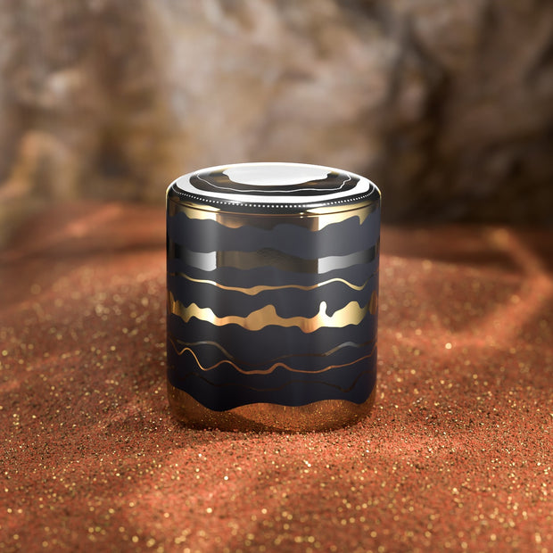 After Hour scented candle on brown sand